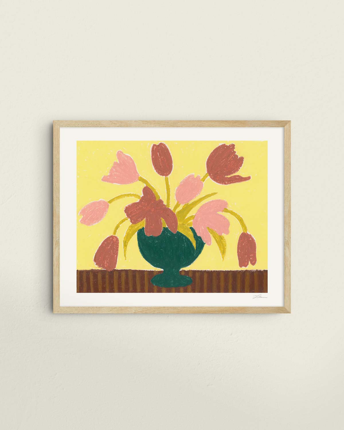 Framed artwork of pink tulips in a green vase on a butter yellow background.